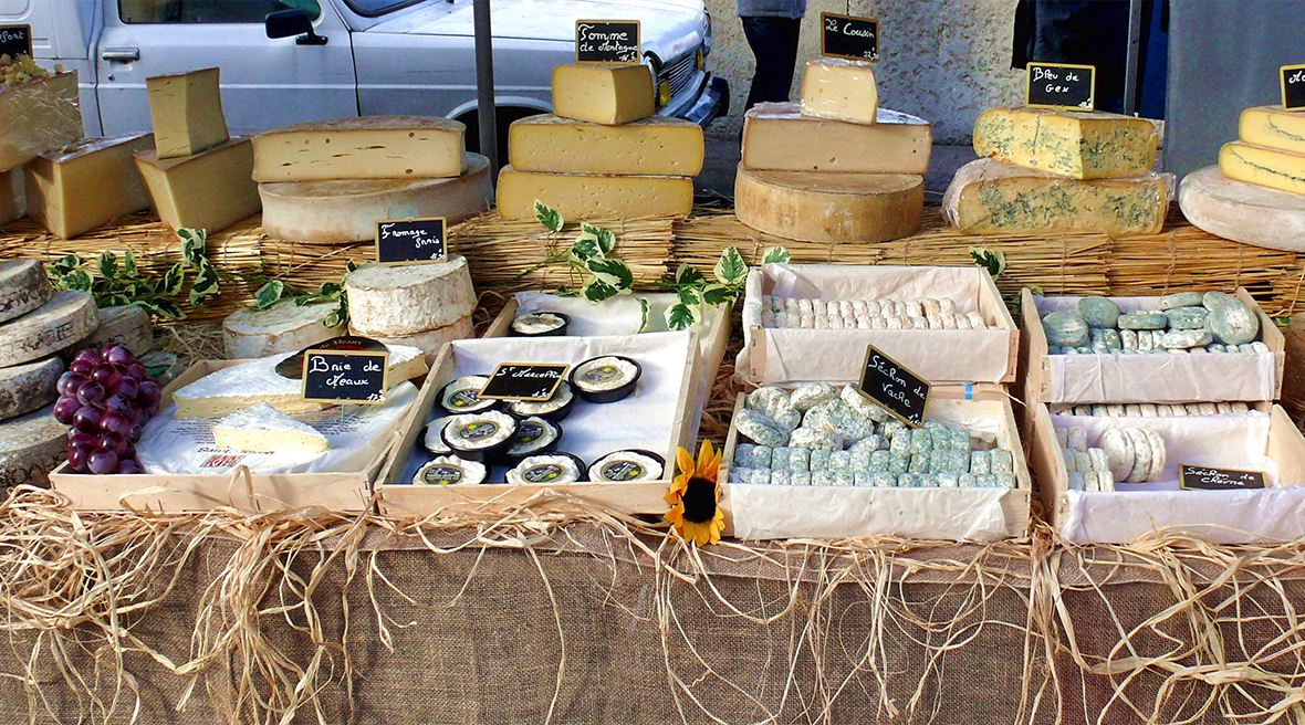 Display of different cheeses at the Lyon Market, France